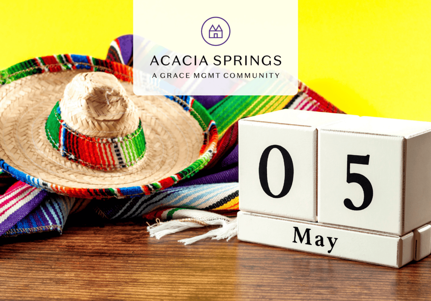 Bright yellow backdrop with a woven sombrero and colorful textiles beside white calendar blocks reading '05 May', logo overlay for Acacia Springs community.